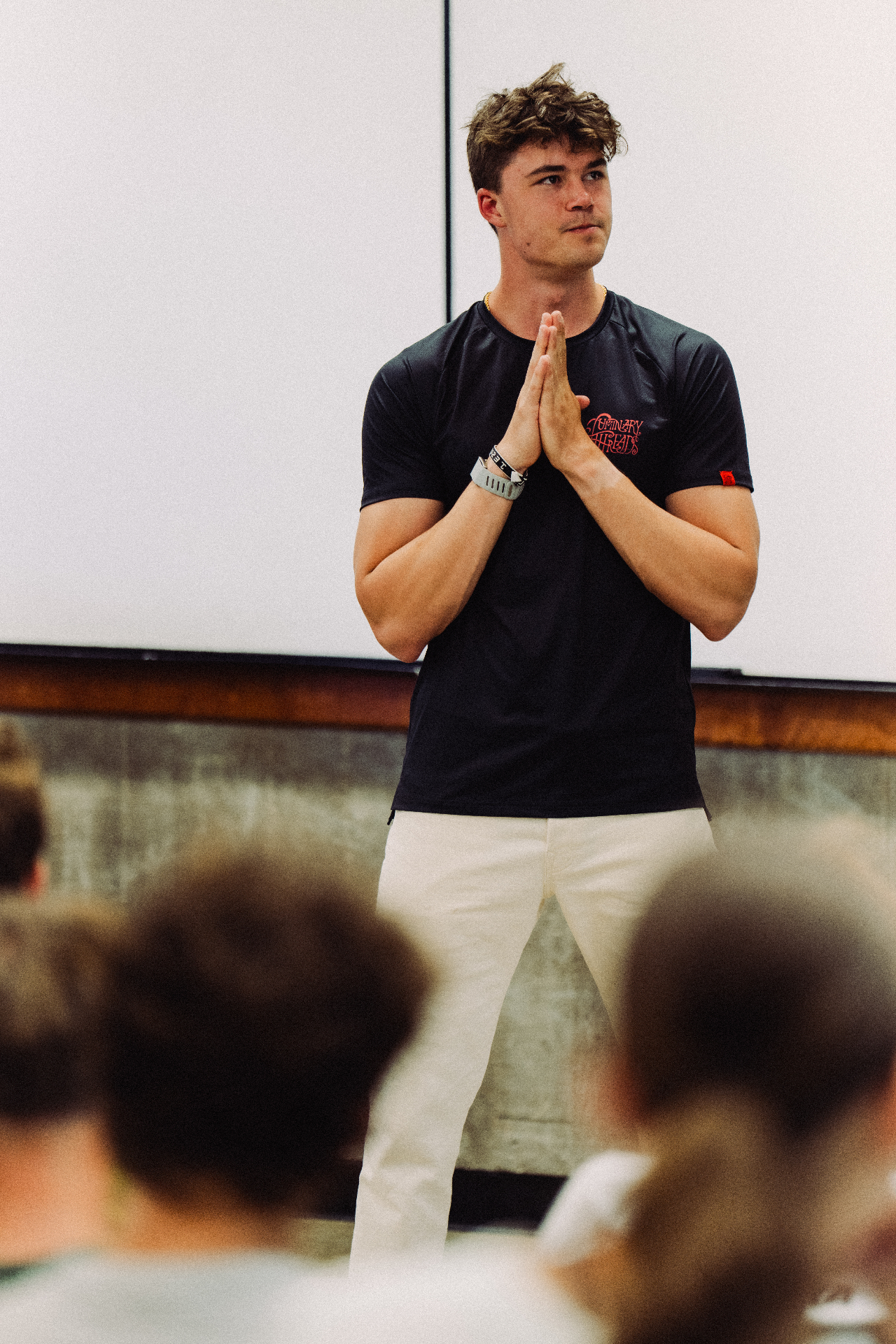 Dominic speaking on stage